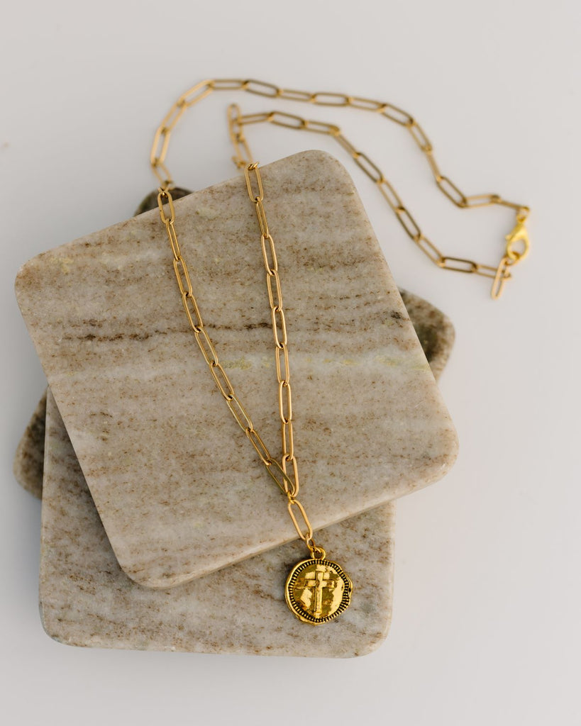 long gold paperclip necklace with cross medallion