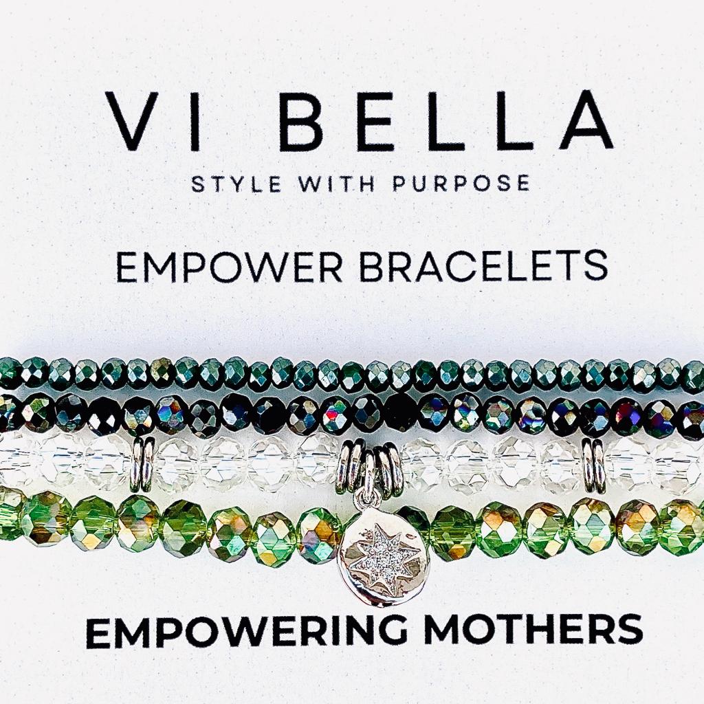 set of four green and clear bracelets with silver accents empowering mothers